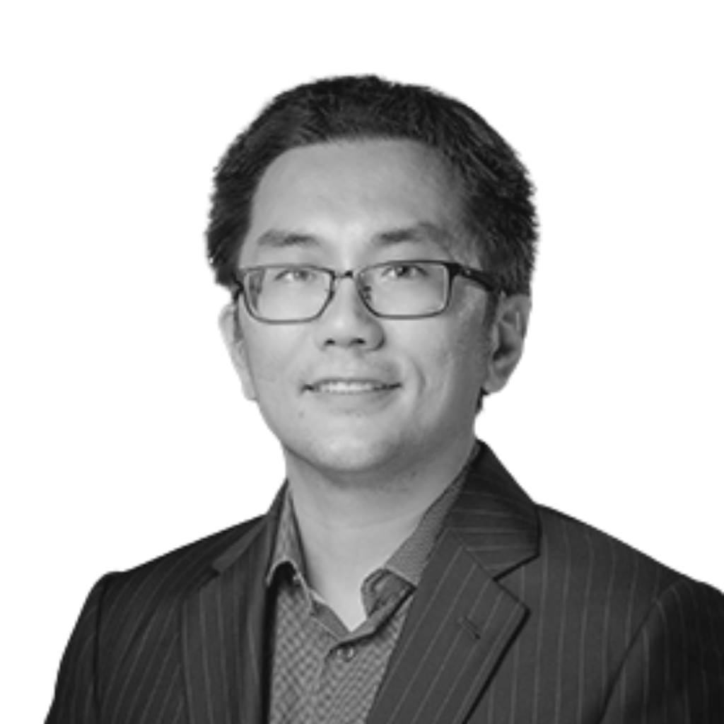 Zhe He, PhD profile photo. Man with dark hair wearing glasses in a suit.